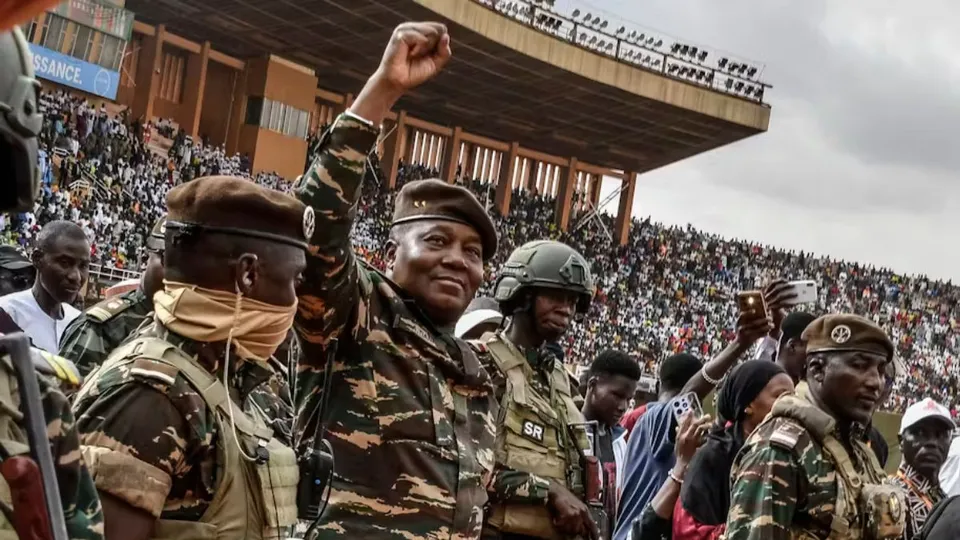 Gen Abdourahamane Tiani (second left), the head of the military regime in Niger, greets a crowd in Niamey in July 2024. Boureima Hama