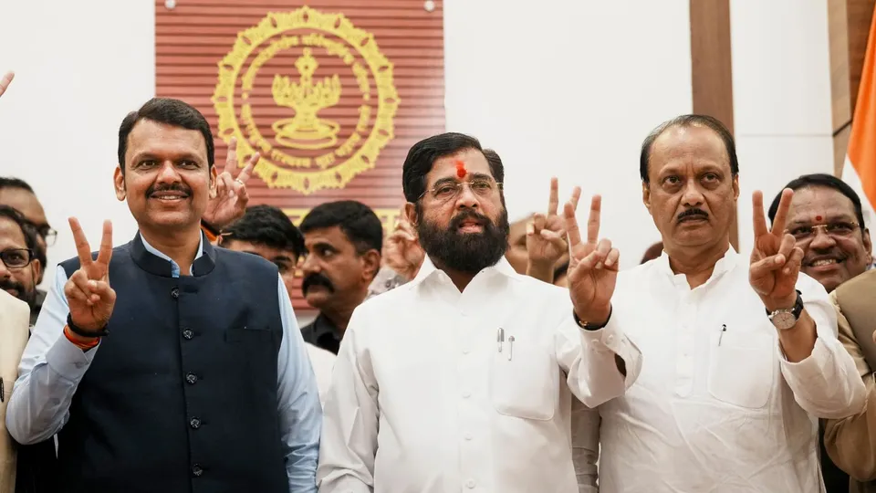 Maharashtra Chief Minister Eknath Shinde with Deputy Chief Ministers Devendra Fadnavis and Ajit Pawar celebrates the victory, in Mumbai, Saturday, Nov. 23, 2024.