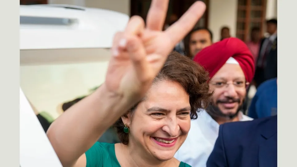 Priyanka Gandhi Vadra flashes victory sign as she leaves after meeting party President Mallikarjun Kharge following her massive victory in the Wayanad Lok Saha by-poll, in New Delhi, Saturday, Nov. 23, 2024. 