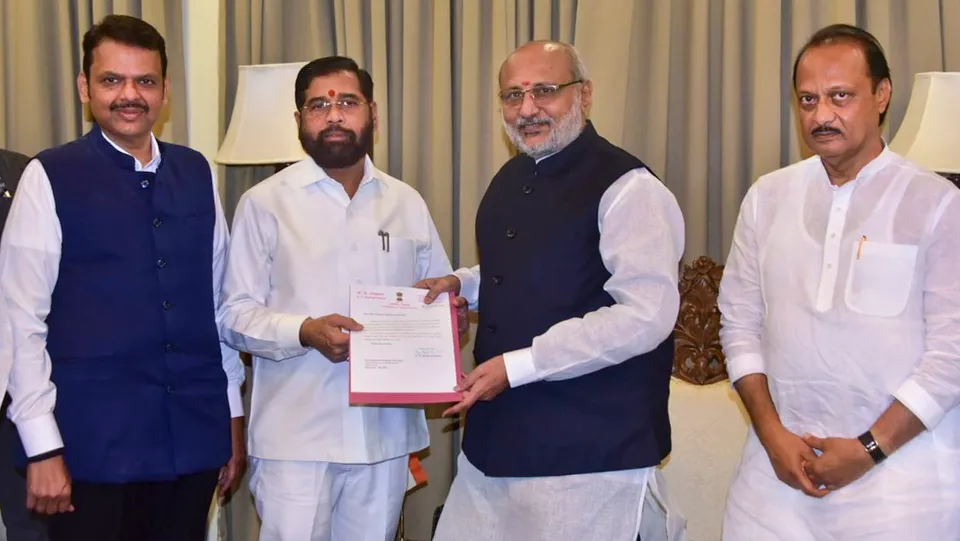Maharashtra Governor C.P. Radhakrishnan receives Shiv Sena leader Eknath Shinde's resignation as state chief minister, as BJP leader Devendra Fadnavis and NCP leader Ajit Pawar look on, in Mumbai, Tuesday, Nov. 26, 2024