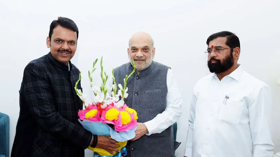 Union Minister and senior BJP leader Amit Shah, Maharashtra BJP leader Devendra Fadnavis, Shiv Sena leader Eknath Shinde exchange greetings during a meeting at Nadda's residence in New Delhi, Thursday, Nov. 28, 2024.