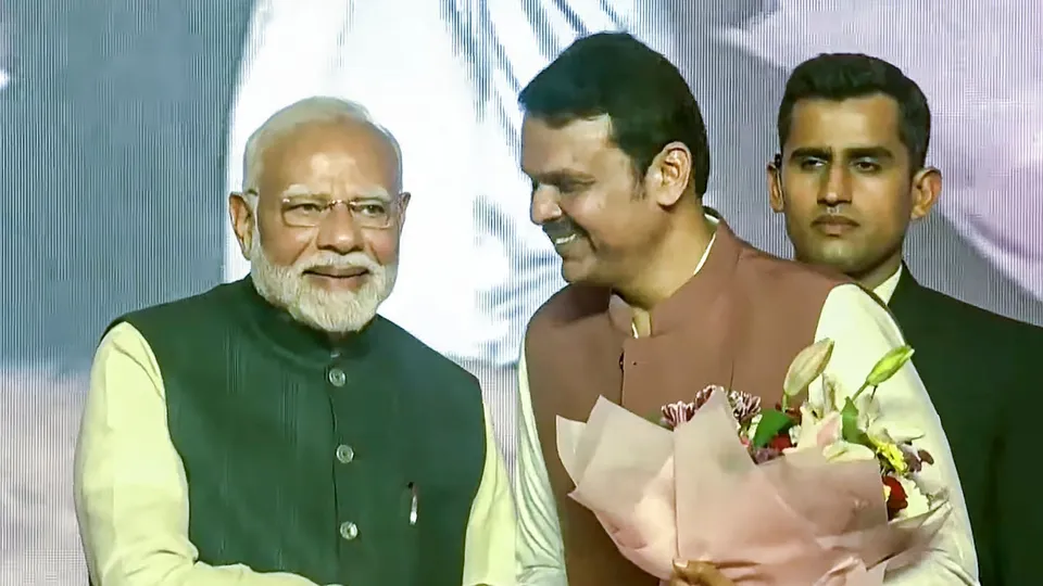Prime Minister Narendra Modi with BJP leader Devendra Fadnavis during the latter's swearing-in ceremony as Maharashtra Chief Minister, in Mumbai, Thursday, Dec. 5, 2024.