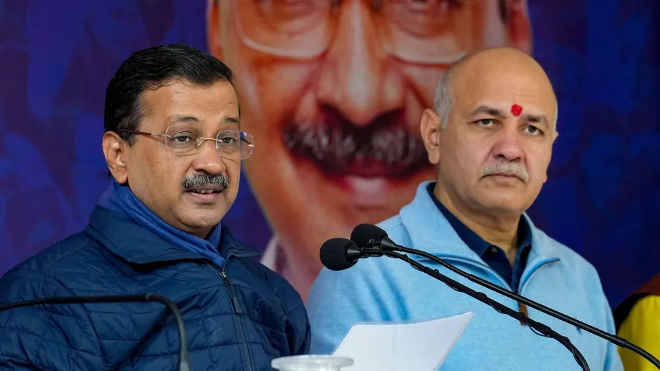 AAP national convener Arvind Kejriwal, left, with party leader Manish Sisodia addresses a press conference at party office, in New Delhi, Friday, Dec. 6, 2024.