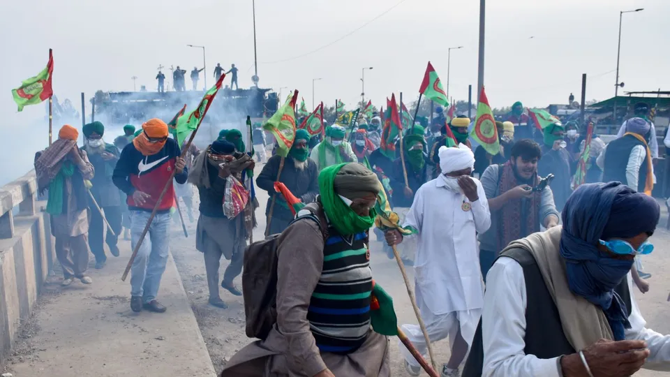 Tear gas being used to disperse protesting farmers at Shambhu Border during their foot march towards Delhi, in Patiala district, Sunday, Dec. 8, 2024.