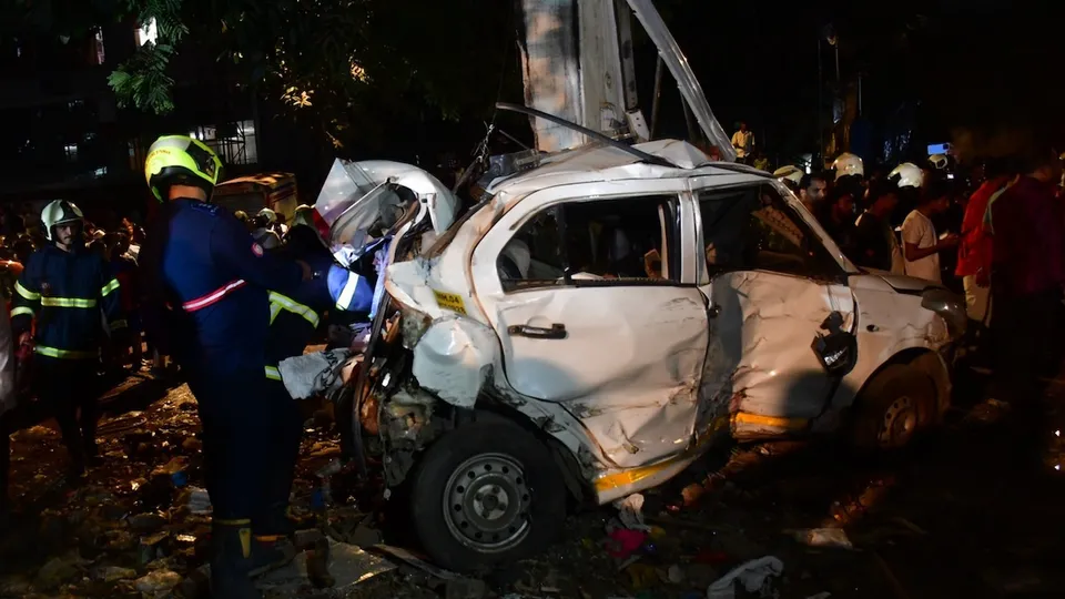 A damaged car being checked at the site after a Brihanmumbai Electric Supply and Transport (BEST) undertaking's bus rammed into pedestrians as well as vehicles on a road at Kurla, in Mumbai, Monday, Dec. 9, 2024.