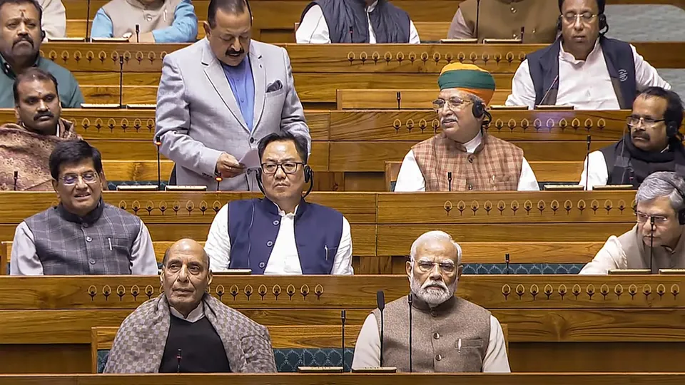 Prime Minister Narendra Modi with Defence Minister Rajnath Singh and others in the Lok Sabha during the Winter session of Parliament, in New Delhi, Wednesday, Dec. 11, 2024.