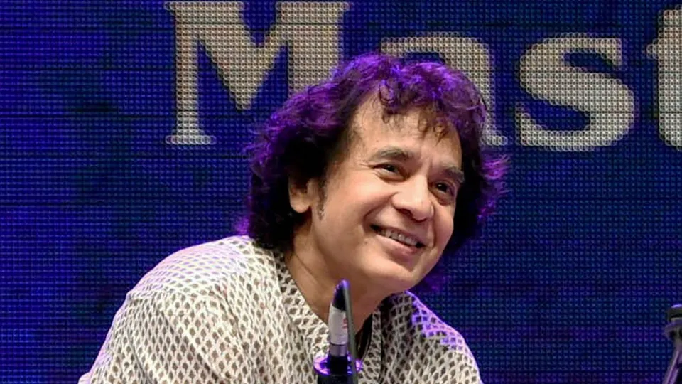 In this Monday, Jan. 9, 2017 file image Tabla maestro Ustad Zakir performs at a concert in Mumbai.