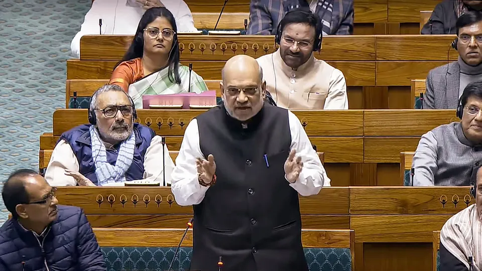 Union Minister Amit Shah speaks in the Lok Sabha during the Winter session of Parliament, in New Delhi, Tuesday, Dec. 17, 2024.