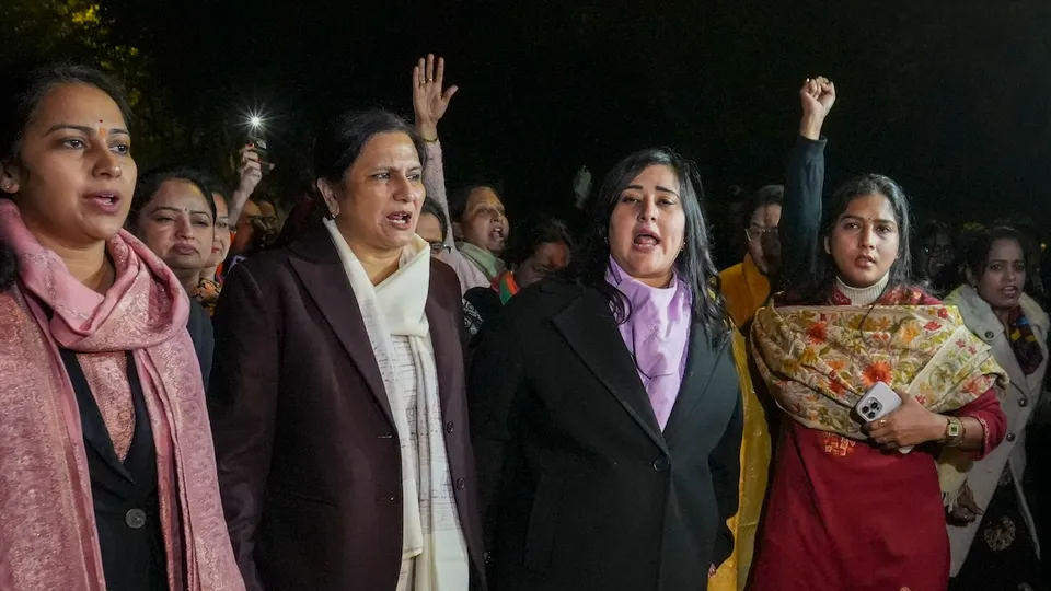 BJP MP Bansuri Swaraj with party workers during a protest against AAP for inviting Samajwadi Party chief Akhilesh Yadav for the 'Mahila Adalat', alleging that his father late Mulayam Singh Yadav once defended those who commit crimes against woman, near AAP convener Arvind Kejriwal's residence, in New Delhi, Monday, Dec. 16, 2024.