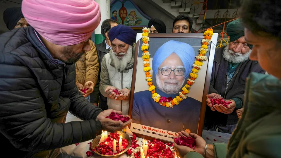 Congress supporters pay tribute to former prime minister Manmohan Singh, who died in New Delhi on Thursday, during a tribute-paying ceremony in Amritsar on Friday, Dec. 27, 2024.