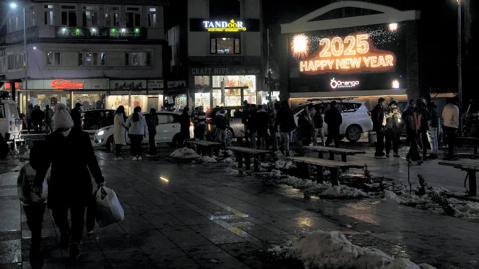 Visitors during new year 2025 celebrations at the clock tower Lal Chowk, in Srinagar, Tuesday, Dec. 31, 2024