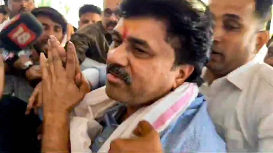 Walmik Karad, a close aide of Maharashtra minister Dhananjay Munde, as he surrenders before the Crime Investigation Department (CID) in Pune on Tuesday, Dec. 31, 2024.