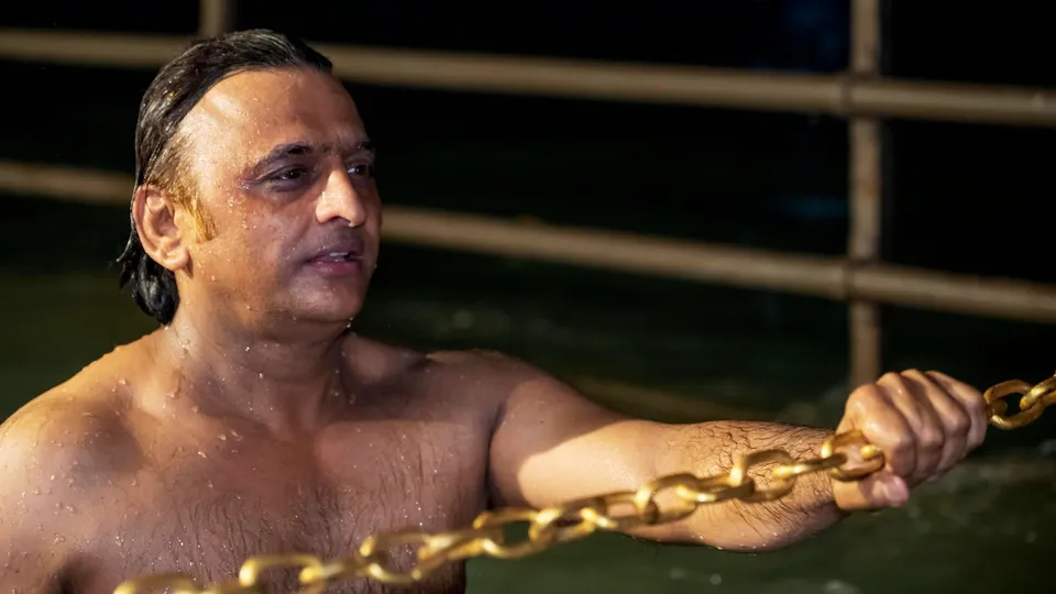 In this handout photo provided by Samajwadi Party on Jan. 14, 2025, Samajwadi Party Chief Akhilesh Yadav takes a dip in the River Ganga on Makar Sankranti, in Haridwar.
