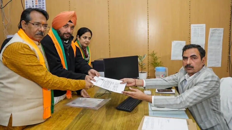 BJP leader and candidate from Gandhi Nagar constituency Arvinder Singh Lovely files his nomination for the upcoming Delhi Assembly elections, in New Delhi. Union Minister Harsh Malhotra is also seen.