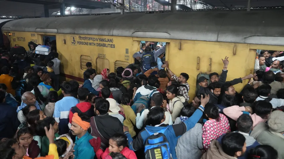 Heavy rush of passengers to catch a train for Mahakumbh, at the New Delhi railway station, Saturday, Feb. 15, 2025. A stampede-like situation occurred at the station.