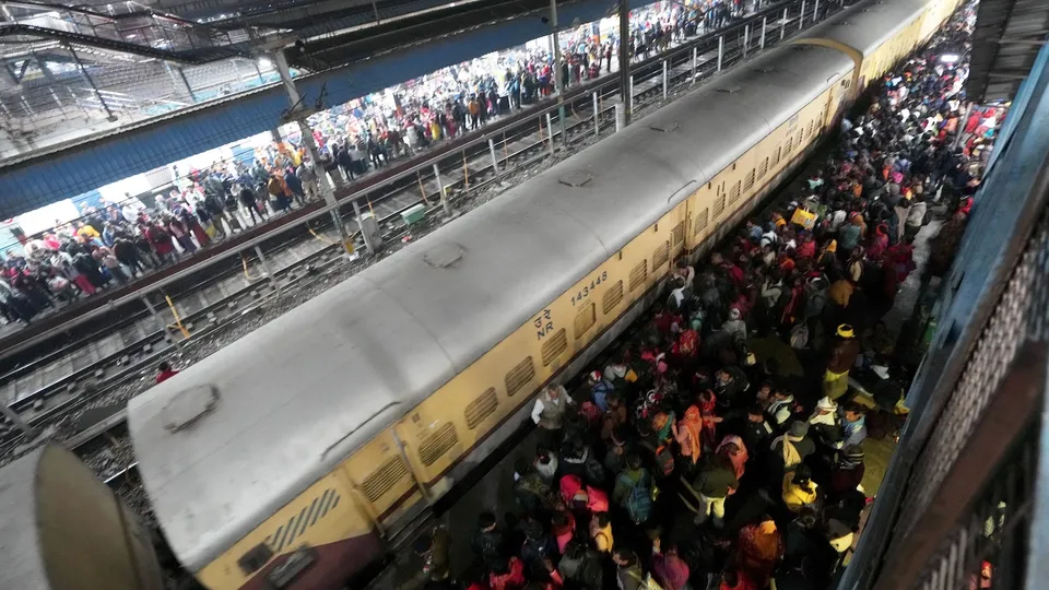 Heavy rush of passengers to catch a train for Mahakumbh at the New Delhi railway station on Saturday, Feb. 15, 2025. 