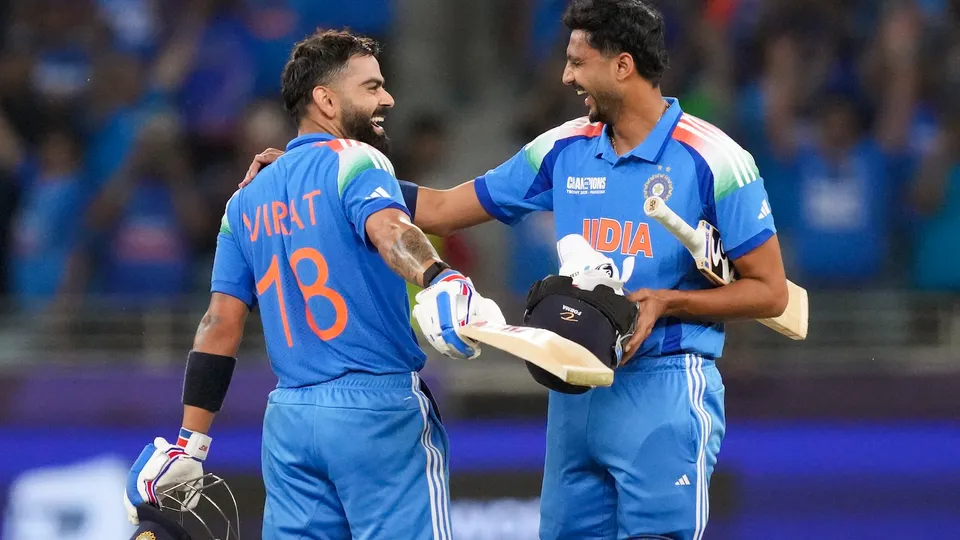Virat Kohli, left, celebrates his century with Axar Patel after scoring the winning runs during the ICC Champions Trophy match against Pakistan in Dubai on Sunday, Feb. 23, 2025. 