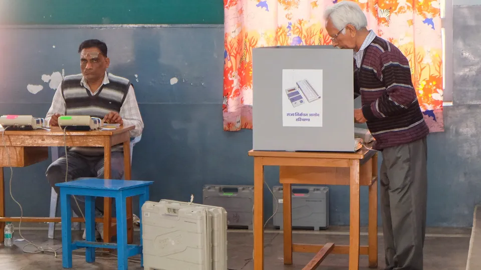 A voter casts vote at a polling booth during the Haryana municipal elections, in Gurugram, Sunday, March 2, 2025.