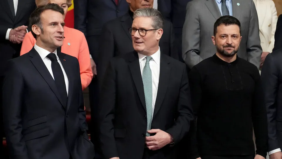 From left, French President Emmanuel Macron, Britain's Prime Minister Keir Starmer and Ukraine's President Volodymyr Zelenskyy pose during a group photo at a summit on Ukraine at Lancaster House in London on Sunday, March 2, 2025.