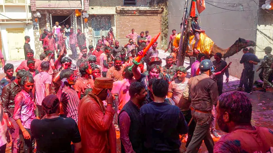 People celebrate Holi festival, in Sambhal district Uttar Pradesh on Friday, March 14, 2025.