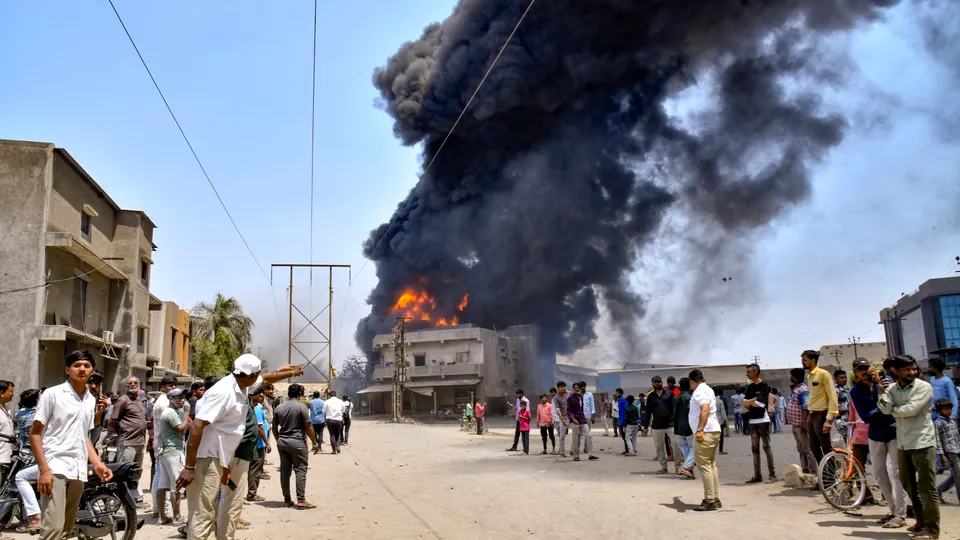Firefighters try to douse a fire that broke out in a chemical factory, in Rajkot, Gujarat, Tuesday, April 1, 2025.