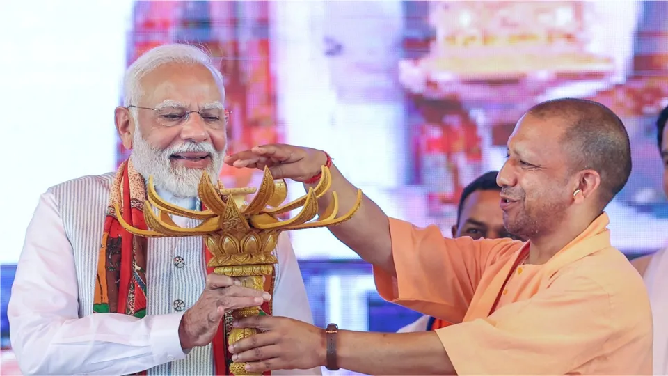 Narendra Modi with Uttar Pradesh Chief Minister Yogi Adityanath during laying of foundation stone and inauguration of various projects, in Varanasi. 