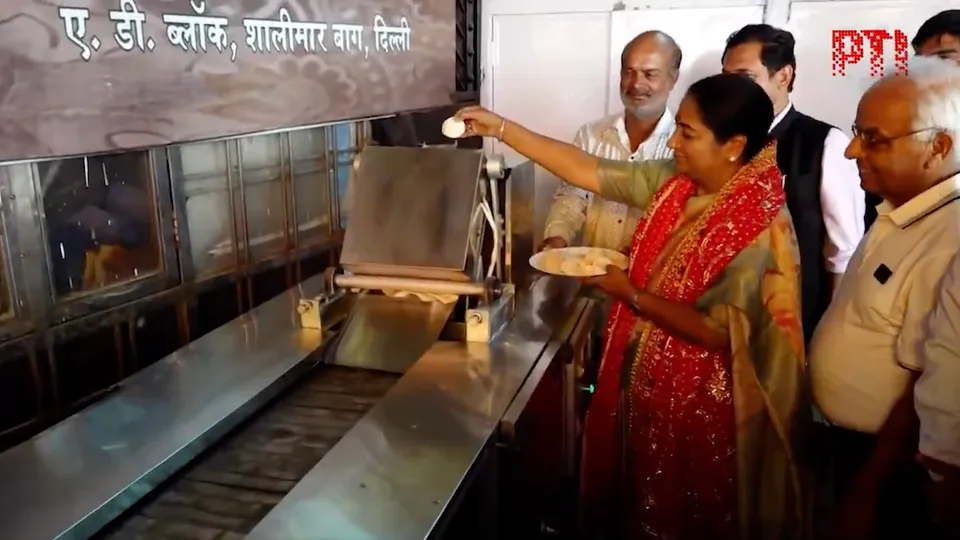 Delhi CM Rekha Gupta inaugurates a roti-making machine at a temple in AD Block in Shalimar Bagh on the occasion of Hanuman Jayanti on Saturday, April 12, 2025.