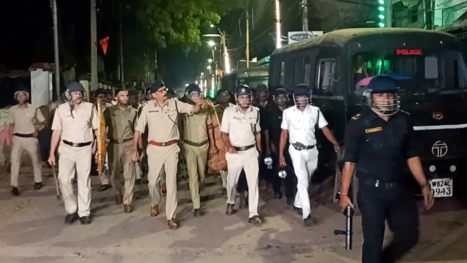 Police and security personnel keep a vigil at an area amid protests over the Waqf (Amendment) Act in Murshidabad on Saturday, April 12, 2025.