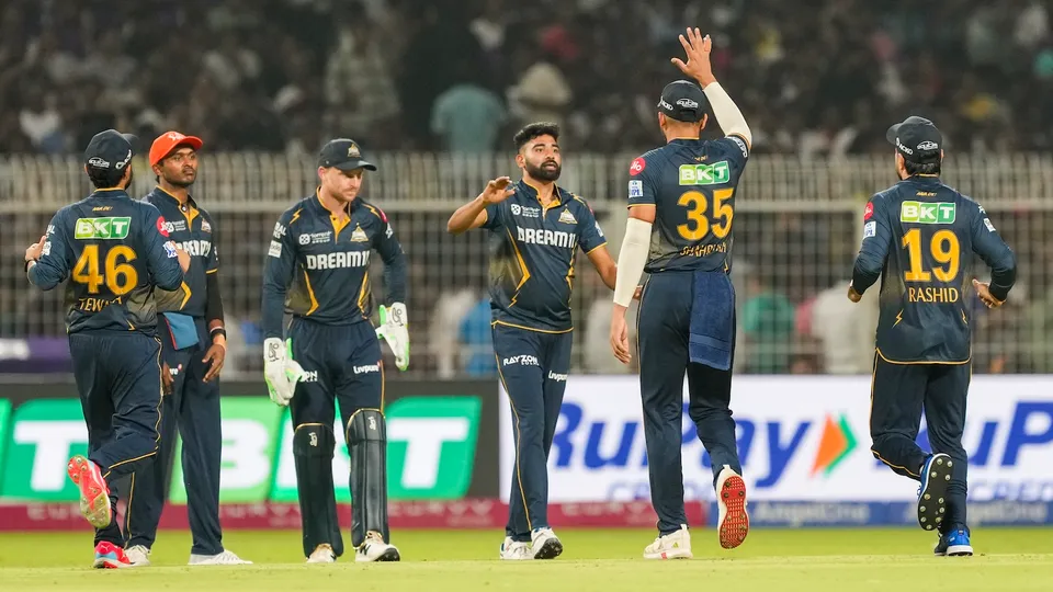 Gujarat Titans' Mohammed Siraj with teammates celebrates the wicket of KKR's Rahmanullah Gurbaz at the Eden Gardens in Kolkata on Monday, April 21, 2025.