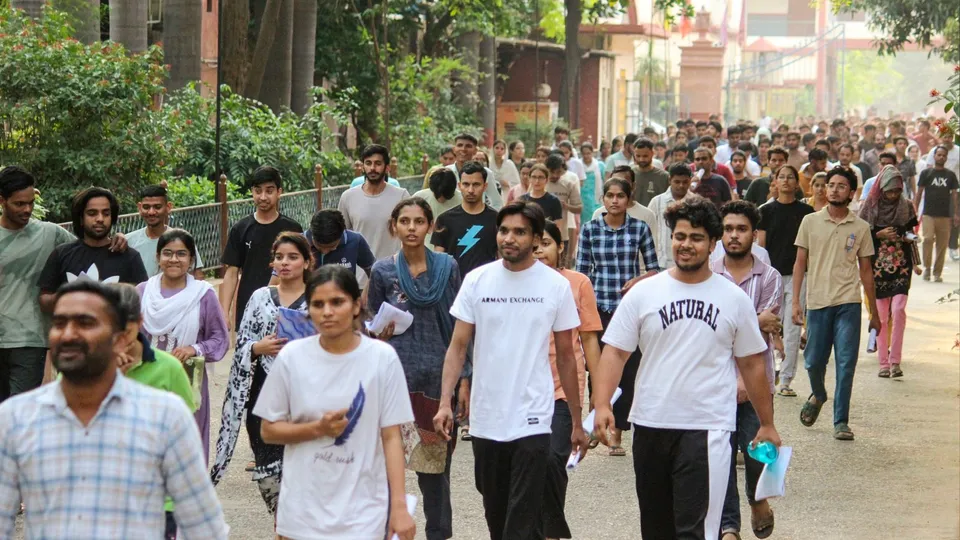 Candidates leave an examination center after appearing for the National Eligibility-cum-Entrance Test (NEET) UG-2025, in Meerut, Uttar Pradesh.