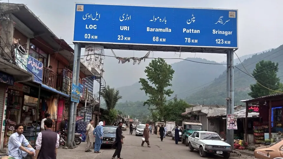 Local residents walk through the main bazaar of Chakothi, near Line of Control, the de facto border dividing Pakistan and Indian Kashmir, some 61 kilometers (38 miles) from Muzaffarabad, the capital of Pakistan controlled Kashmir on Thursday, May 1, 2025.