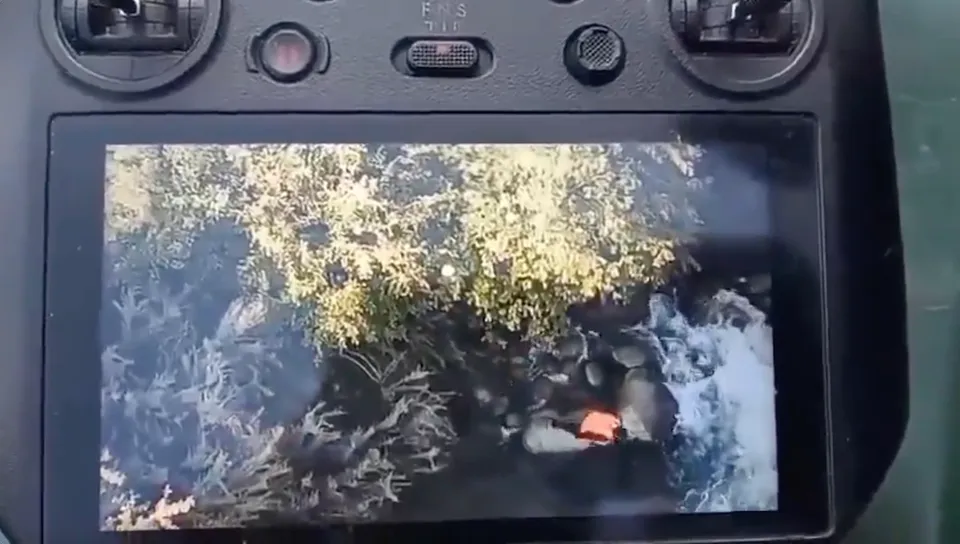 Drone video shows Kulgam OGW jumping into stream on Sunday, May 4, 2025.