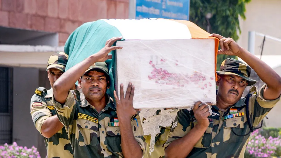 BSF personnel carry the mortal remains of BSF Sub-Inspector Mohammad Imtiaz, who lost his life in the line of duty in Jammu district, in Patna