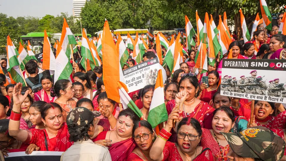 BJP women workers attend a Tiranga Rally to hail the Indian armed forces' Operation Sindoor, in New Delhi.