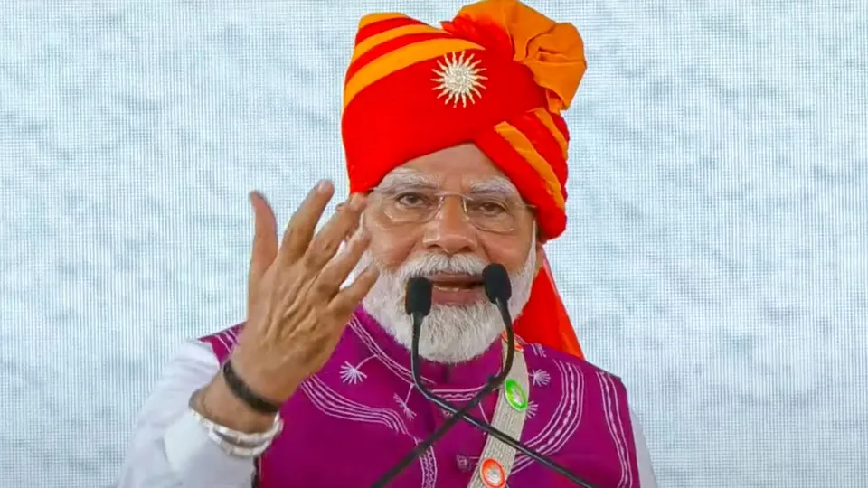 Prime Minister Narendra Modi addresses a public meeting during the inauguration of Loco Manufacturing Shop and various development projects, in Dahod