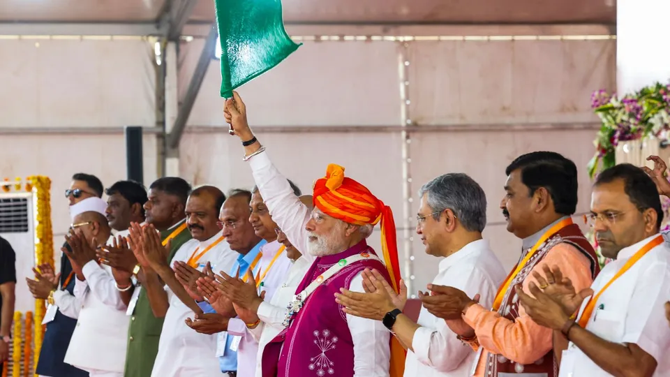 PM Narendra Modi with Union Minister for Railways Ashwini Vaishnaw and others during a public meeting, in Dahod, Gujarat.