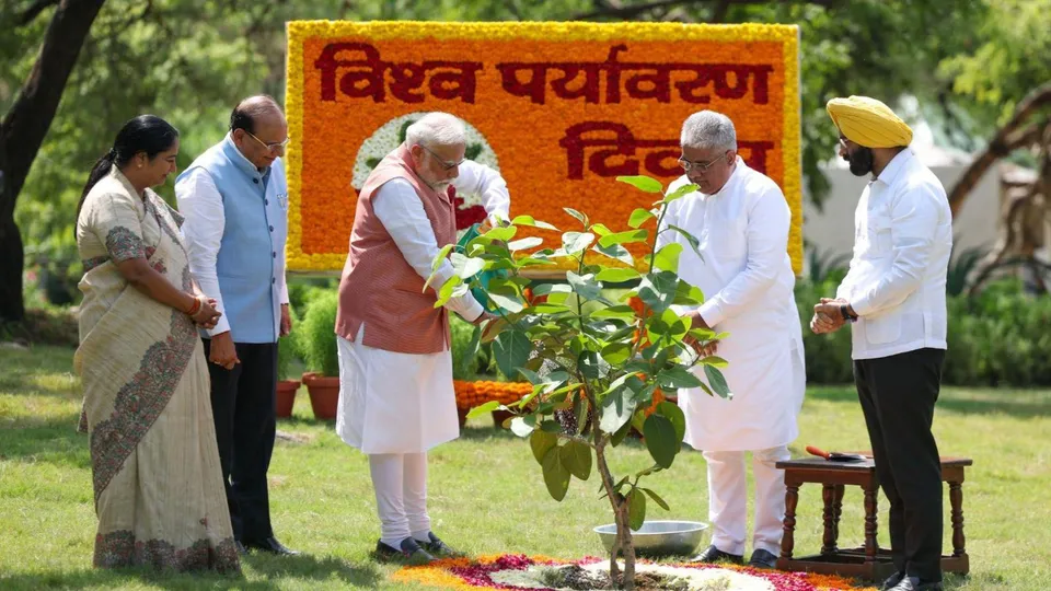 PM Narendra Modi plants a banyan sapling at Bhagwan Mahavir Vanasthali Park as part of the �Ek Ped Maa Ke Naam� initiative, on the occasion of World Environment Day, in New Delhi.