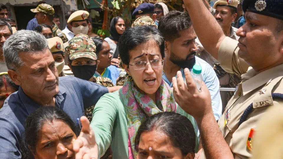 LoP in Delhi Assembly Atishi arrives at the Bhoomiheen jhuggi-jhopri (JJ) camp, at Kalkaji, in New Delhi, Tuesday, June 10, 2025. Eviction notices by the Delhi Development Authority have been pasted at houses in the jhuggi-jhopri camp, warning 'encroachers' to leave the spot within three days, or face action.