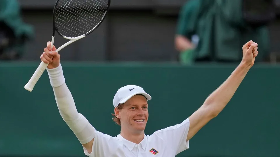 Italy's Jannik Sinner celebrates after beating Carlos Alcaraz of Spain to win the men's singles final at the Wimbledon Tennis Championships in London, Sunday, July 13, 2025.
