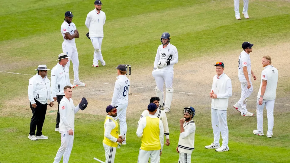 Ravindra Jadeja and Washington Sundar, along with England's players, at a drinks break during the fifth day of the fourth Test match between India and England, at the Old Trafford cricket ground, in Manchester, England, Sunday, July 27, 2025.