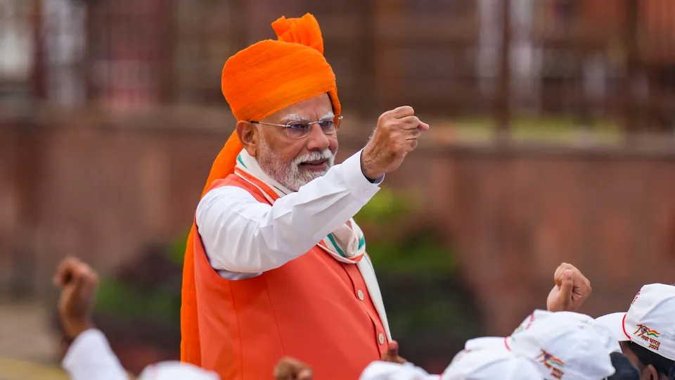 Prime Minister Narendra Modi interacts with students during the 79th Independence Day celebration at the Red Fort, in New Delhi, Friday, Aug. 15, 2025.