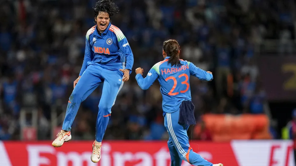 Shafali Verma, left, celebrates with captain Harmanpreet Kaur after taking the wicket of South Africa's Marizanne Kapp during the ICC Women's World Cup final ODI cricket match at the DY Patil Stadium, in Navi Mumbai, Sunday, Nov. 2, 2025.