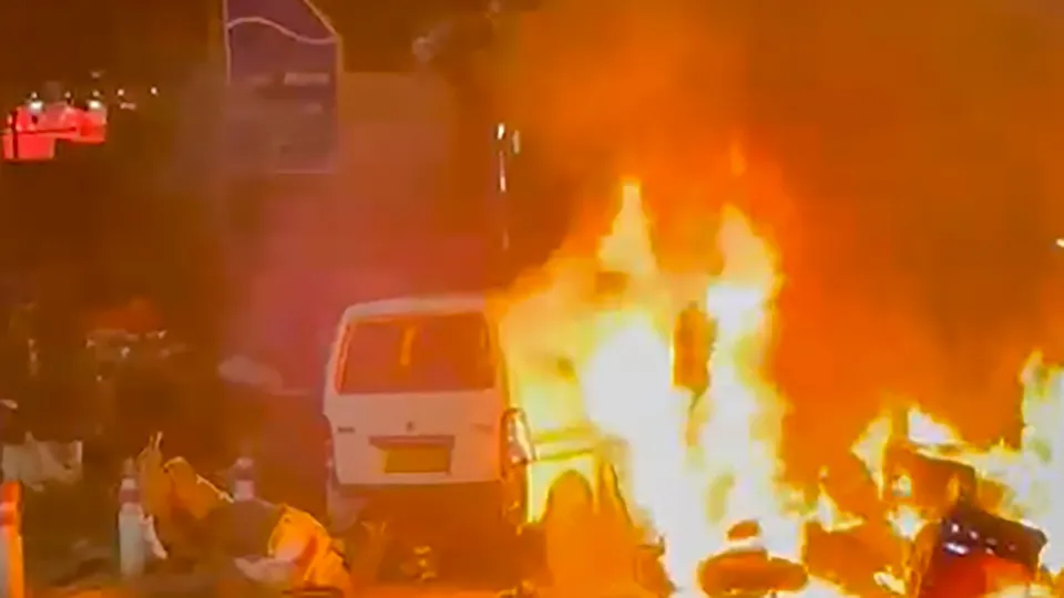 Flames rise after a blast occurred in a parked car near Red Fort, in New Delhi, Monday, Nov. 10, 2025.