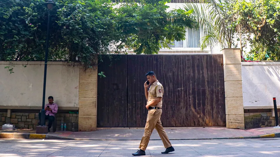 Security personnel keep vigil outside the residence of veteran actor Dharmendra, 89, who was admitted to Breach Candy Hospital, in Mumbai, Tuesday, Nov. 11, 2025.