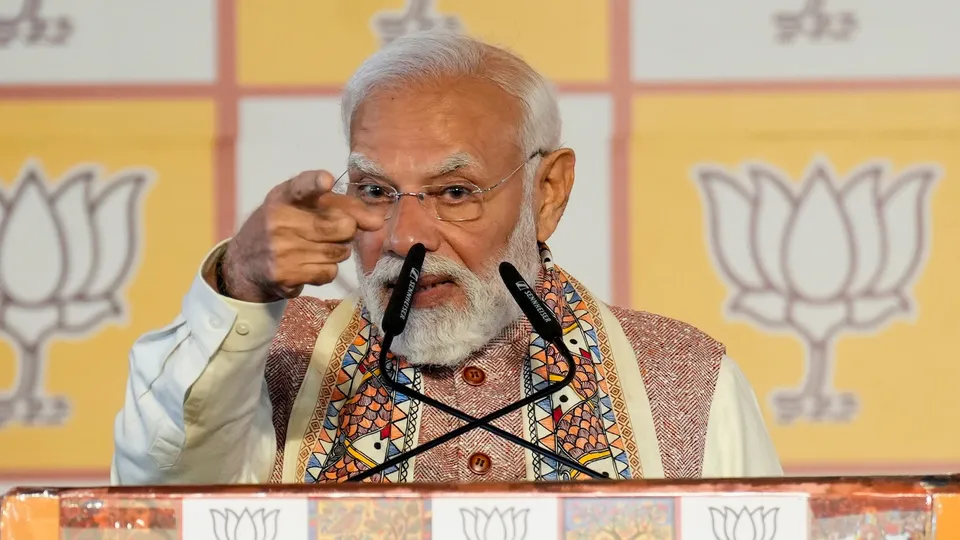 Prime Minister Narendra Modi addresses the gathering during the celebration of NDA's victory in the Bihar Assembly elections, at BJP headquarters, in New Delhi, Friday, Nov. 14, 2025.