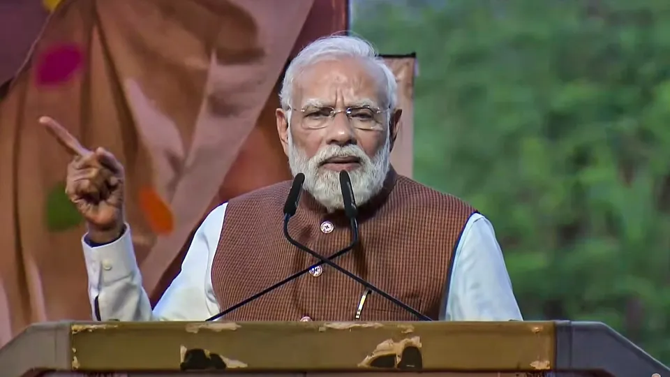 Prime Minister Narendra Modi addresses members of the Bihari community during an event at the airport, in Surat, Gujarat.