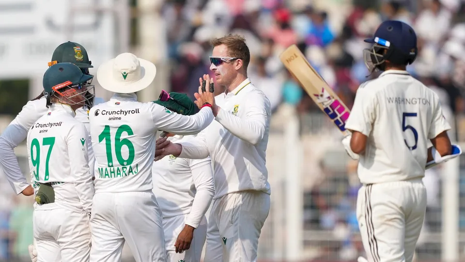 Simon Harmer with teammates after the wicket of Ravindra Jadeja during the third day of the first Test cricket match of a series between India and South Africa, at Eden Gardens in Kolkata, Sunday, Nov. 16, 2025.