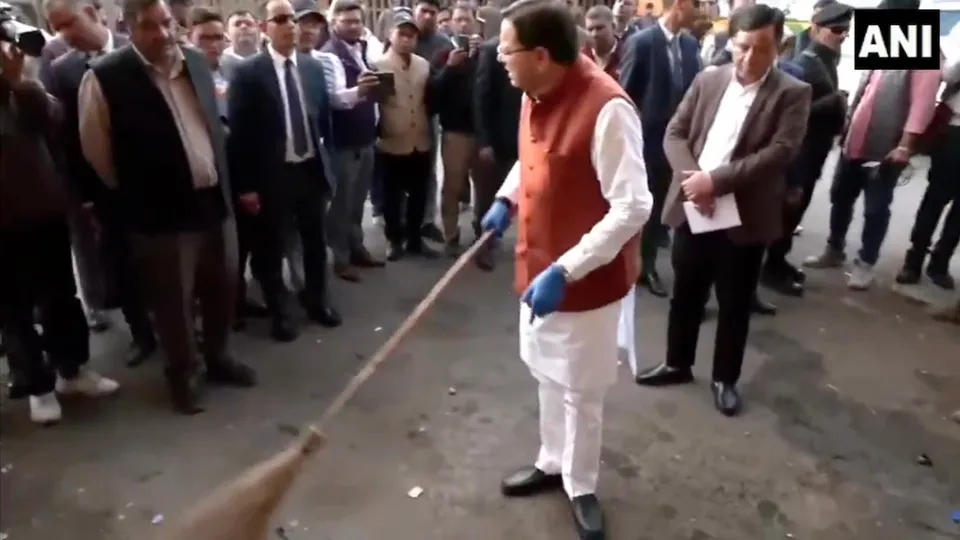 Pushkar Singh Dhami cleans ISBT Dehradun during a surprise inspection on Tuesday, Nov 18, 2025.
