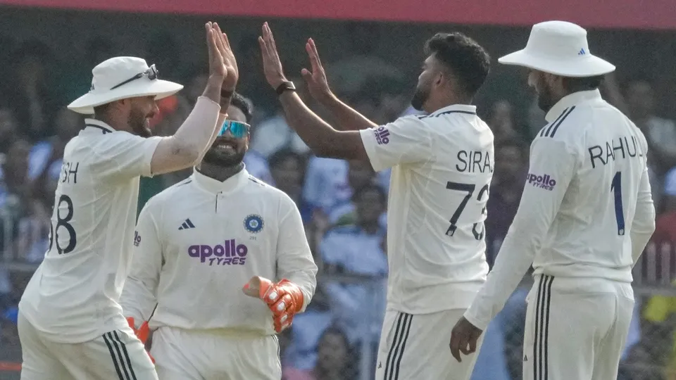 Mohammed Siraj with teammates celebrates after the wicket of South Africa's Senuran Muthusamy during the day two of the second Test cricket match of a series between India and South Africa, at ACA Stadium in Guwahati, Sunday, Nov. 23, 2025.