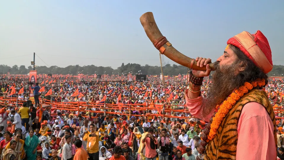 People take part in the 'five-lakh-voices Gita chanting' event at the Brigade Parade Ground, in Kolkata, Sunday, Dec. 7, 2025.